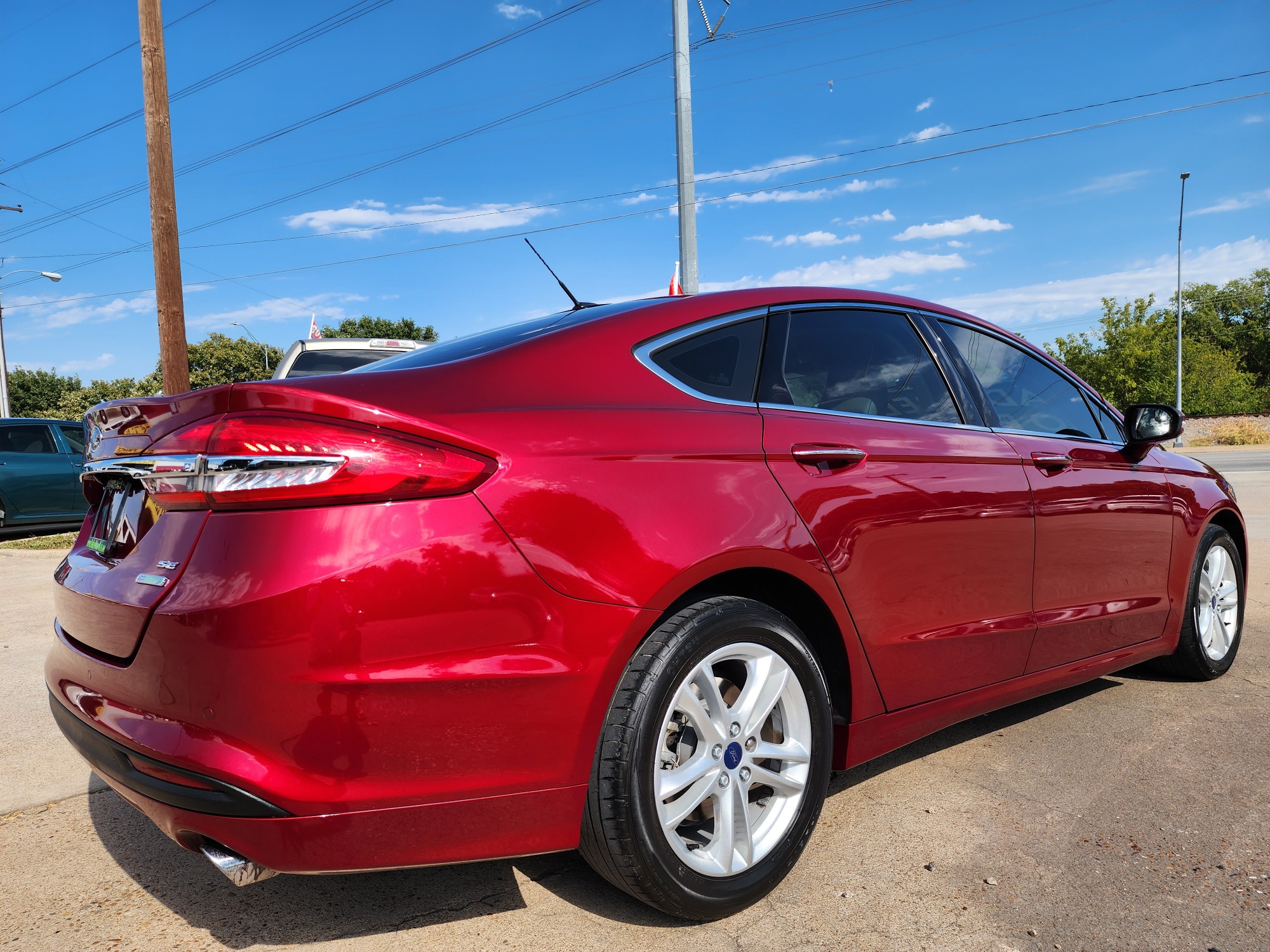 2018 RED Ford Fusion SE (3FA6P0HD2JR) with an 1.5L L4 DOHC 16V engine, 6A transmission, located at 2660 S.Garland Avenue, Garland, TX, 75041, (469) 298-3118, 32.885551, -96.655602 - Welcome to DallasAutos4Less, one of the Premier BUY HERE PAY HERE Dealers in the North Dallas Area. We specialize in financing to people with NO CREDIT or BAD CREDIT. We need proof of income, proof of residence, and a ID. Come buy your new car from us today!! This is a 2019 FORD FUSION SE SEDAN! - Photo #3